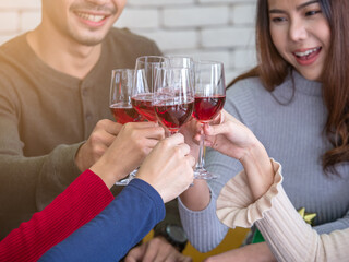 Toasting wine glasses, 5 teens enjoying at the party. Celebrating at party, New Year, Christmas or success concept.