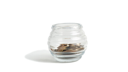 Thai coins in a glass bowl. on a white background and clipping path.