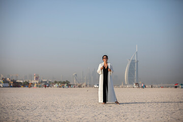 Obraz na płótnie Canvas middle aged fashionable woman on Dubai Beach 