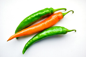 Yellow red and green capsicum on a white background