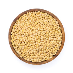 Wooden bowl with peeled pine nuts isolated on white background,