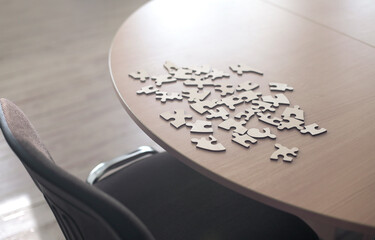 Puzzles are on the office table. Business problem solving concept.
