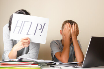 Learning difficulties, remote education, online learning and working at home. Tired mother and sad kid need help to do homework