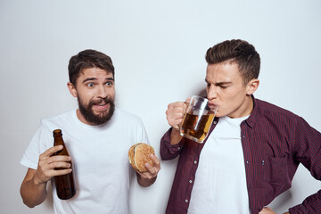 Two friends drink beer leisure fun alcohol friendship lifestyle light background