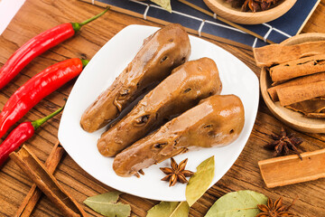 Delicious spiced duck head on a plate