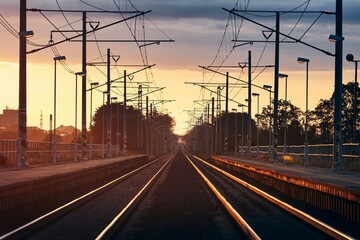 Fototapeta na wymiar Railroad track at beautiful sunrise