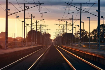 Foto op Plexiglas Railroad track at beautiful sunrise © Chalabala