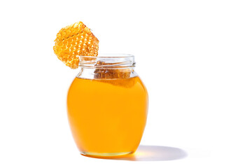 Glass can full of honey and Honeycomb in her isolated on white background