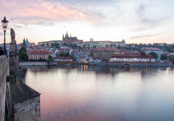 Fototapeta na wymiar Prague charles bridge sunset view with castle in backgorund