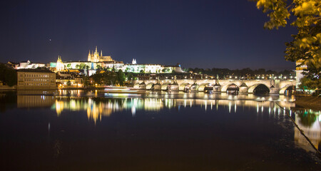 Fototapeta na wymiar Pargue charles bridge and prague castle by night reflections river