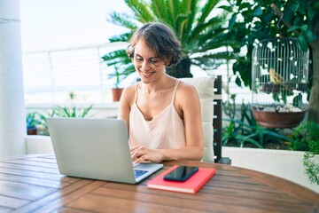 Young beautiful caucasian woman smiling happy working from home