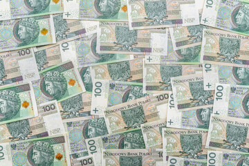 Background made of the Polish 100 zloty banknote, background for finance and economy.