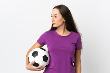 Young hispanic woman over isolated white background with soccer ball