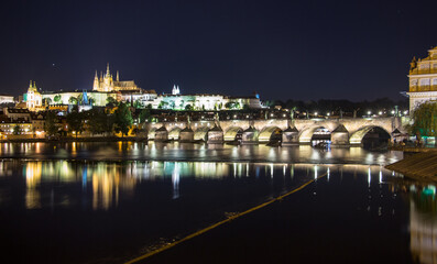 Pargue charles bridge and prague castle by night reflections river