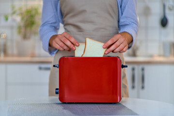 Modern red toaster for cooking toasts