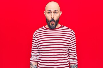 Young handsome man wearing casual clothes scared and amazed with open mouth for surprise, disbelief face