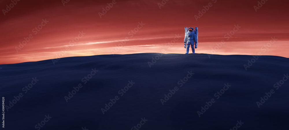 Wall mural astronaut doing space walk and explore a distant planet such as mars.