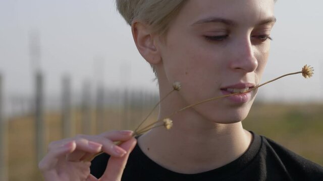 androgyne portrait of blonde young model, outdoor portrait, natural harmony