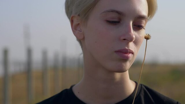 androgyne portrait of blonde young model, outdoor portrait, natural harmony