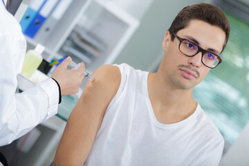 doctor doing tetanus toxoid injection in patient