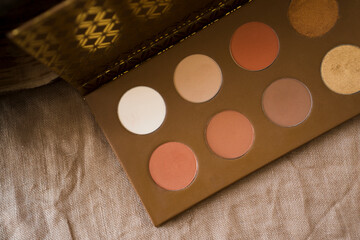 Top view of eye brown shadow on a background of burlap