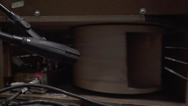 Close up of Microphone recording vintage Leslie 122 in professional music studio