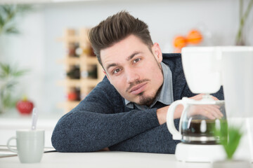 man in the kitchen preparing a coffee at home