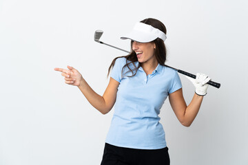 Young golfer woman over isolated white background pointing finger to the side and presenting a product
