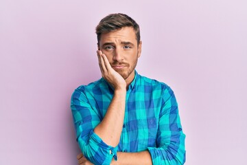 Handsome caucasian man wearing casual clothes thinking looking tired and bored with depression problems with crossed arms.