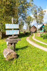 Homemade sign for the sale of milk and cottage cheese. Text in Russian: milk, curd