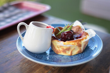 Close up cake with berry and winter berries. Cheesecake.dessert. Healthy food. Creative atmospheric decoration.