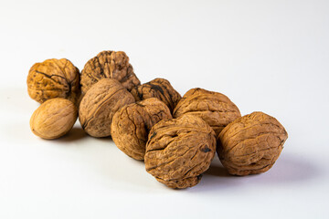 A few walnuts placed on blank background