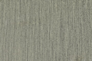 The rough texture of the natural fabric of gray color. Linen cloth, coarse burlap.