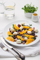 salad with mozzarella,  pistachios,oranges,  caramelized beetroot and sprouted sunflower