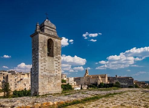 Gravina in Puglia, Italy. The path of pebbles and stones that leads to the Sanctuary of Madonna della Stella, with its bell tower and the ancient cave church carved into the rock.