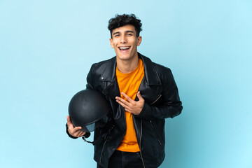 Argentinian man with a motorcycle helmet smiling a lot