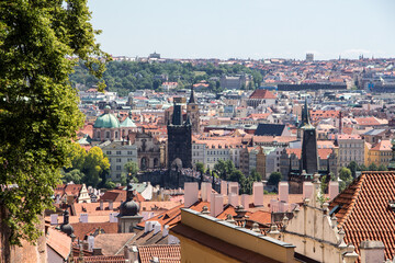 Fototapeta na wymiar Prague old town sunny panorama view old town natural tree frame