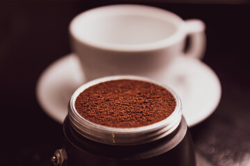 Freshly ground coffee ready to brew in moka pot