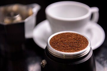 Freshly ground coffee ready to brew in moka pot