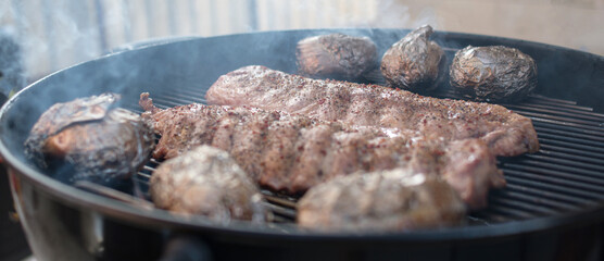 Pork ribs baked to a crisp on a smoky gril