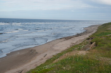 white sea surf view from the cliff
