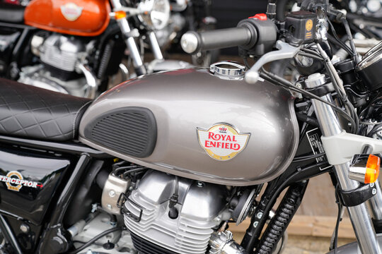 Royal Enfield logo and text sign on grey silver Indian motorbike steel tank of vintage re motorcycle