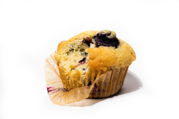 Blueberry muffin against white background.