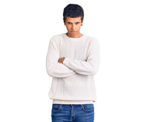 Young african amercian man wearing casual clothes skeptic and nervous, disapproving expression on face with crossed arms. negative person.