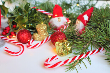 Christmas greeting card. Christmas gnomes (elf) wearing big red hat on white background.