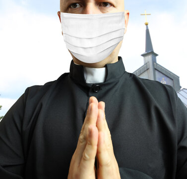 Praying Priest In A Mask