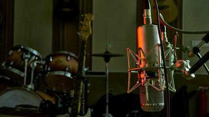 High Class Condenser Microphone in close up a professional recording studio. color
