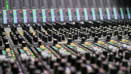 Mixing console for sound producer. Music. Sound. Sound controller. Director's remote. selective focus. color