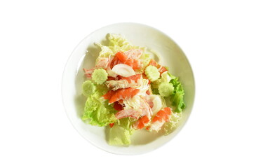 boiled shrimp slice topping on slice cabbage and onion with tomato salad on plate