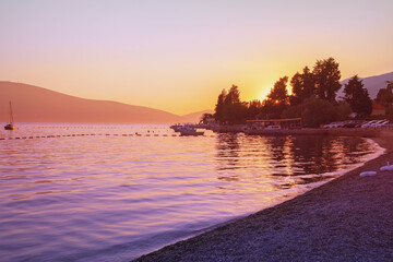 Obraz premium Autumn sunset. Beautiful Mediterranean landscape. Montenegro, view of Kotor Bay near Tivat city